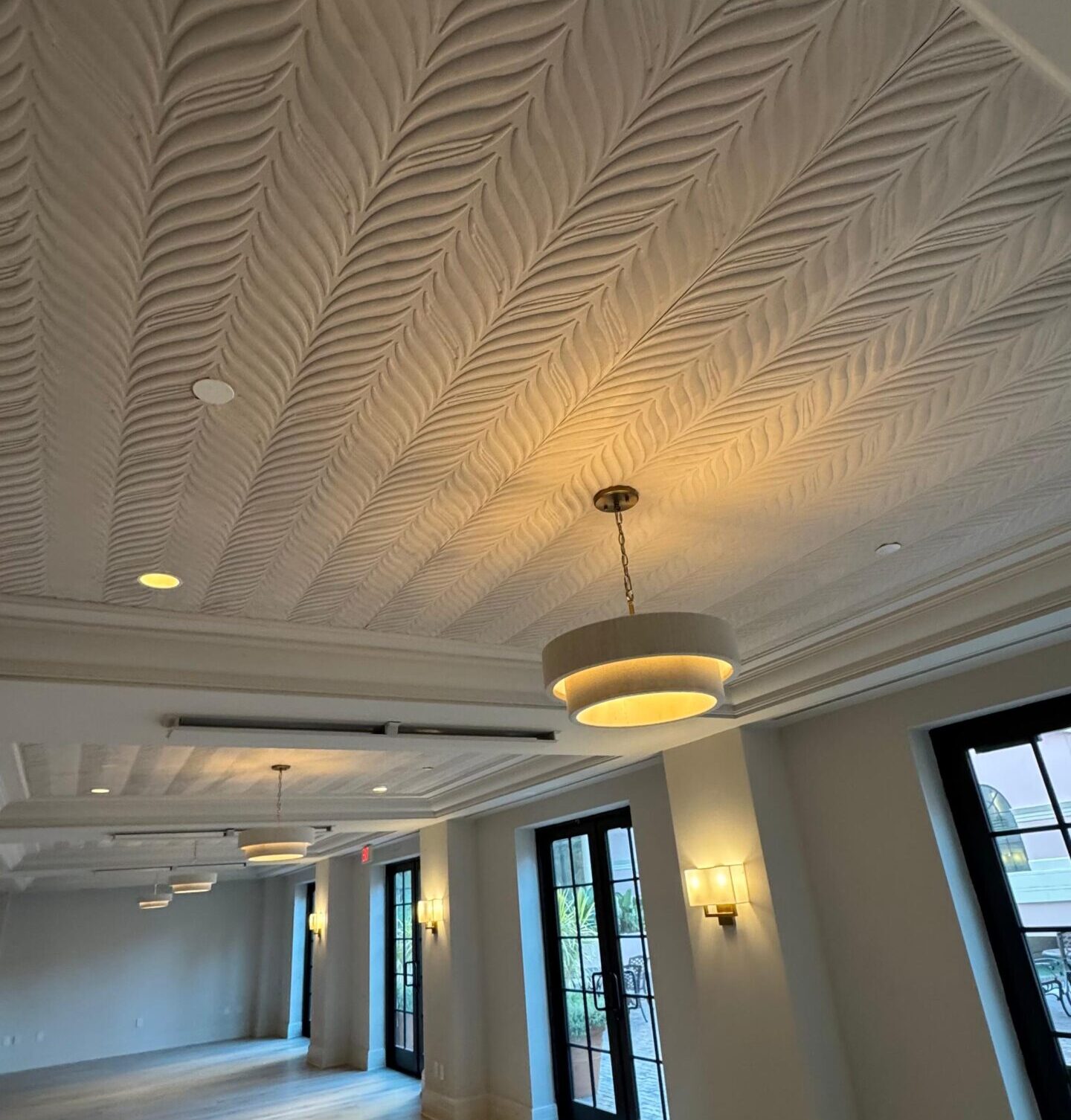 Decorative ceiling wallpaper installation in luxury Florida home